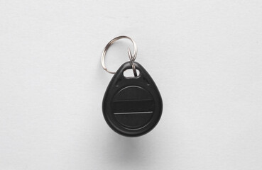 Plastic magnetic key on gray background