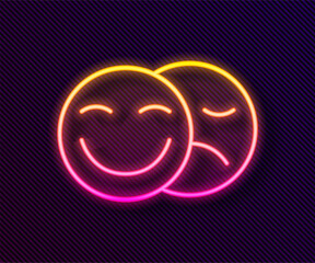 Glowing neon line Comedy and tragedy theatrical masks icon isolated on black background. Vector
