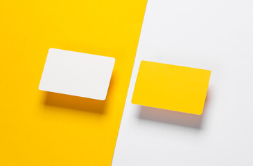 white and yellow blank plastic bank cards on a colored background