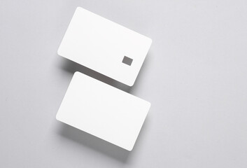 White blank bank cards on gray background. Template for design