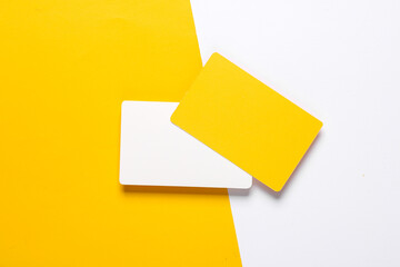 white and yellow blank plastic bank cards on a colored background