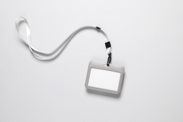 Id card badge with belt on gray background