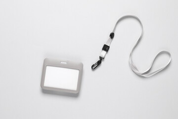 Id card badge with belt on gray background