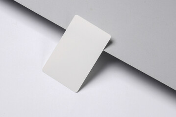 White blank bank card with chip on gray-white background. Creative layout
