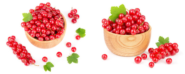 Red currant berries in a wooden bowl with leaf isolated on white background