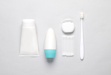 Objects for personal hygiene on a gray background. Flat lay