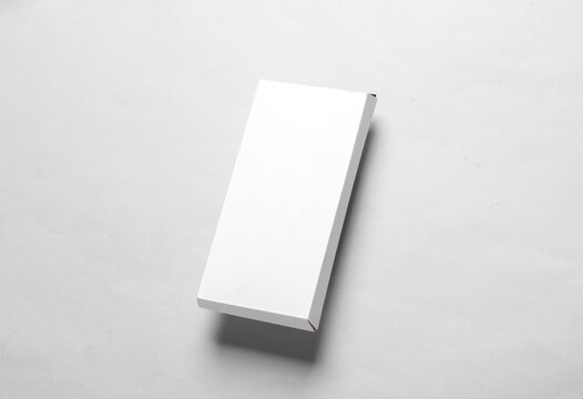 Mockup of white cardboard box for chocolate bar on gray background