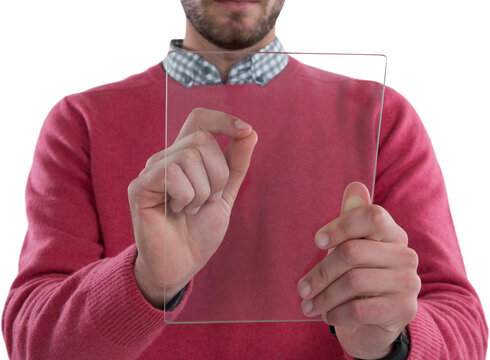 Mid section of man using glass digital tablet