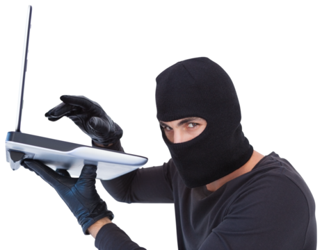 Focused burglar hacking into laptop