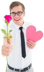 Obraz premium Geeky hipster holding a red rose and heart card
