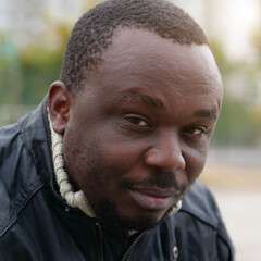 African american man from Nigeria looks at camera