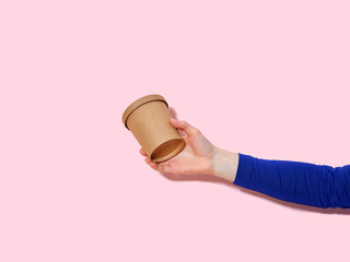 Female hand holding an ecological container for take away soup