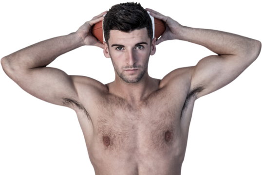Portrait of a shirtless man holding ball over head