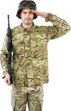 Portrait of soldier holding rifle and saluting