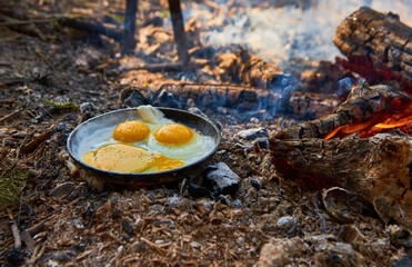 eggs fried on the bonfire in the forest
