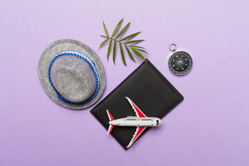 Traveler accessories on color background, top view