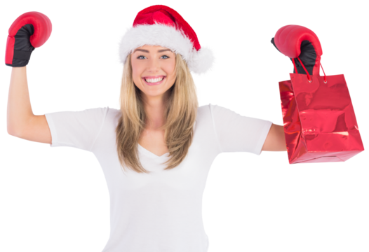 Festive blonde punching with boxing gloves