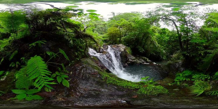 Cascading waterfall and river in mountain rainforest. Negros, Philippines. 360 panorama VR.