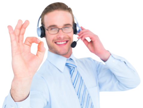 Smiling businessman with headset making ok sign - Powered by Adobe
