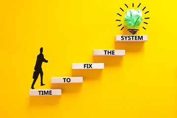 Time to fix the system symbol. Concept words Time to fix the system on wooden block. Beautiful yellow table yellow background. Businessman icon. Business and time to fix the system concept. Copy space