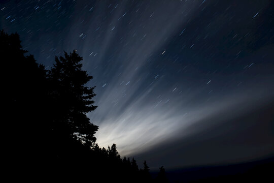 Light streaming through the night sky, The Ovens Natural Park; Nova Scotia, Canada