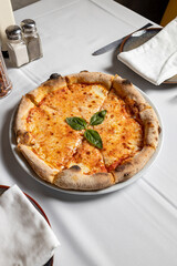 Margherita pizza, served in Italian restaurant