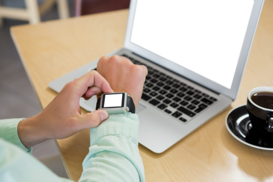 Cropped image of man using smart watch