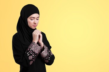 Young Muslim woman greeting on the background