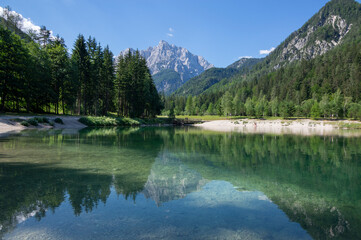 Lake called Jasna in European Slovenian Julian Alps, beautiful water surface with reflections near the road to Vrsic Pass