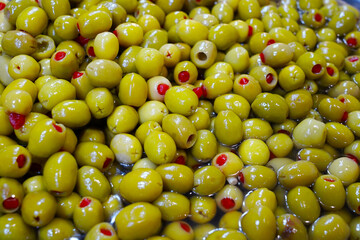 green olives with paper in a bazaar                   