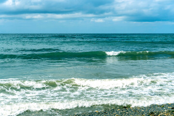 small storm on the sea, waves hitting the shore