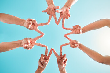 Hands, star and group of people in teamwork, collaboration and support outdoors in a circle for...