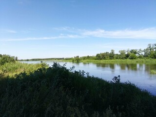 water, lake, landscape, nature, sky, river, summer, reflection, clouds, pond, forest, tree, green, cloud, grass, trees, blue, view, spring, outdoor, sun, scenery, scenic, peaceful, travel