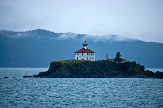 Eldred Lighthouse sits on a bluff overlooking the water, Alaska, USA; Alaska, United States of America