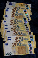 200 euro banknotes european bill cash money isolated on black background two hundred euro close up modern high quality instant stock print