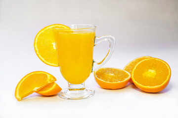 glass of fresh orange juice with fresh fruit on white background     