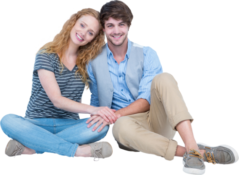 Happy couple sitting on the floor