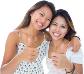 Two smiling asian women giving thumbs up 