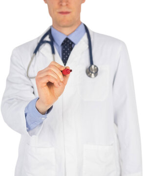 Serious doctor writing with marker on white background