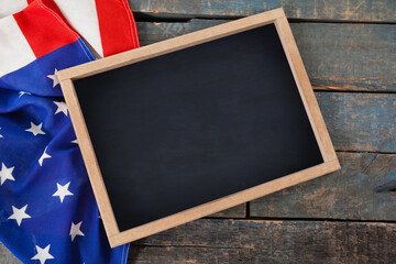 American flag with chalkboard on table
