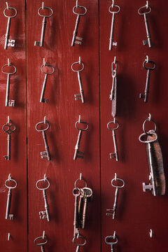 Vintage skeleton keys hanging on hooks; Massachusetts, United States of America