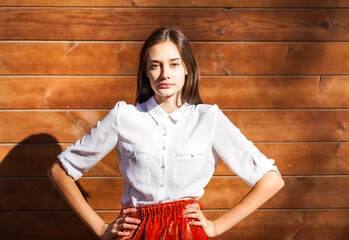 Young teenage brunette girl in white shirt