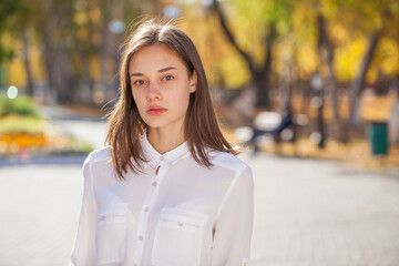 Portrait of a young beautiful model in white shirt