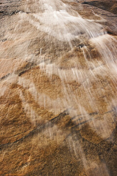 Cascading waterfall down a rock cliff; Hellemoboten, Tysfjord, Norway
