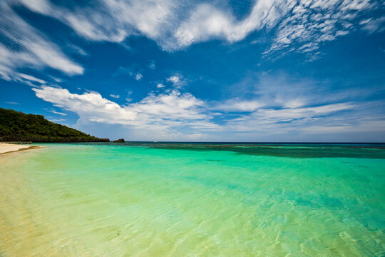 Tranquil green ocean water in West Bay Beach in Roatan, Honduras; Roatan, Honduras