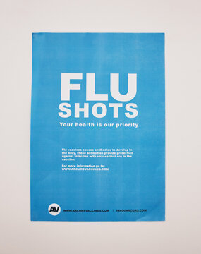 Healthcare background, vaccine and flu shot poster on wall in clinic, hospital and medical pharmacy. Sign, information and advertising vaccination for influenza, immunity and treatment for protection