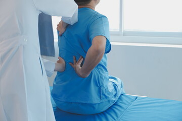 Women Asian doctors hold the patient hand and encourage and provide medical advice While checking...