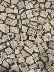 White paving stones on the roads of Portugal, top view