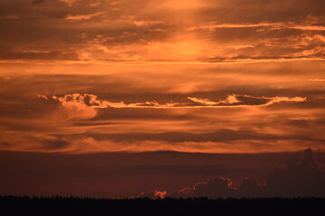 Obraz premium Red blue pink evening sky in summer. Beautiful sunset in the evening. Gradient sky.