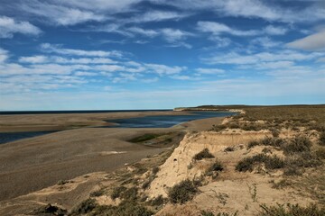 coastal landscape of the Valdes peninsula in Argentina with cloudy blue sky